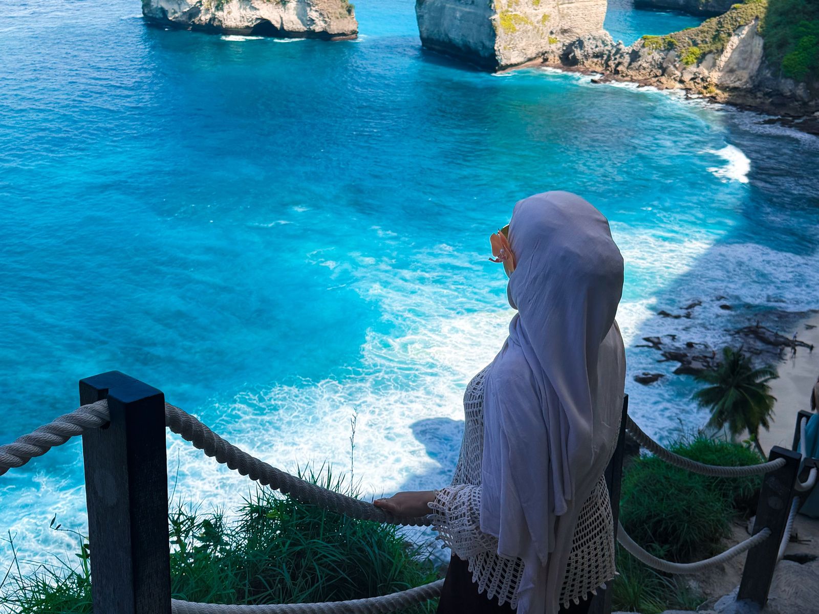 A traveller at an east-coast viewpoint rail