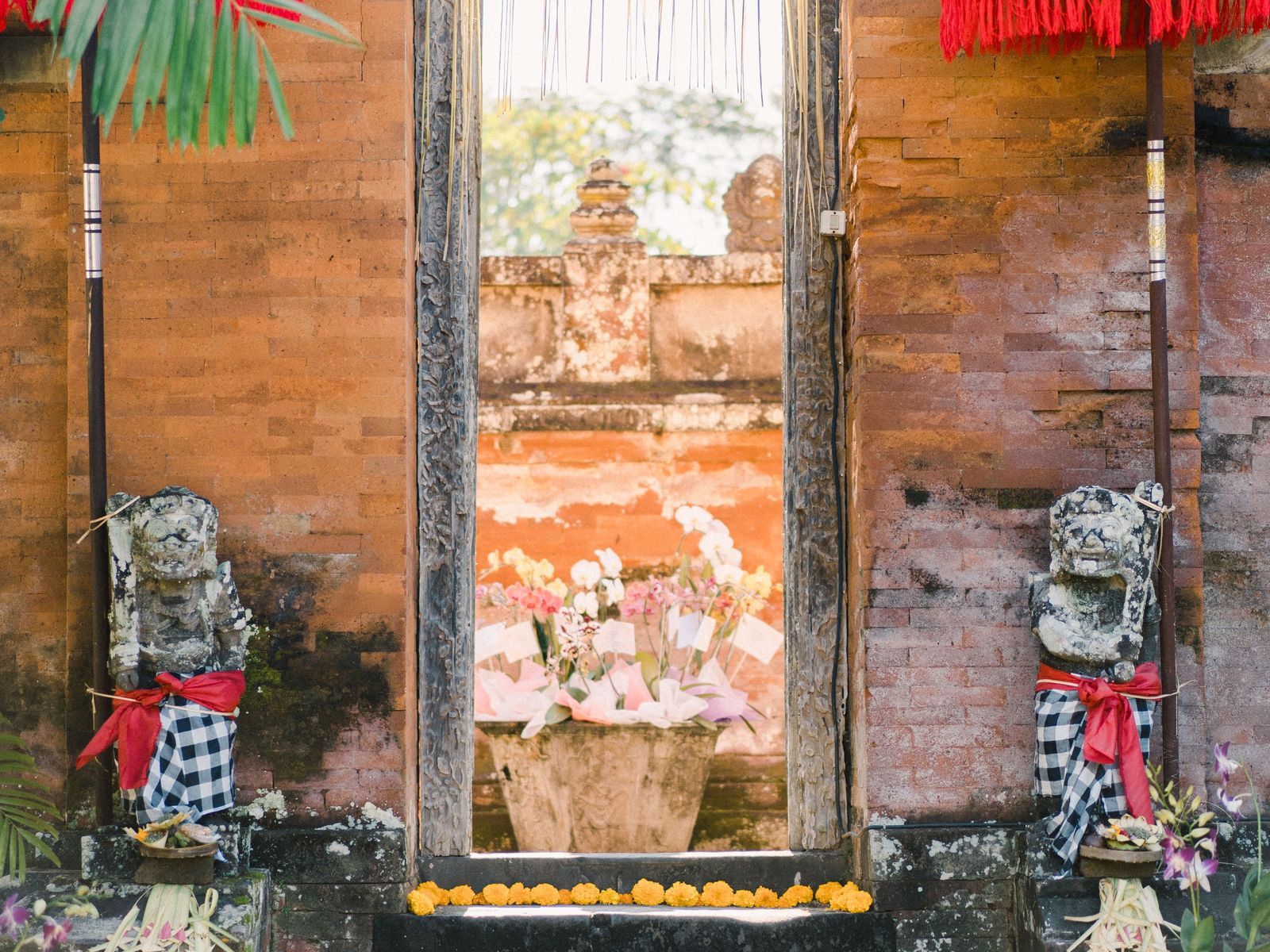 A temple gate dressed with offerings